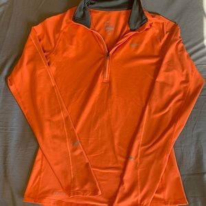 Nike Dri-Fit 1/2 Zip Pullover. Size small. Color orange.